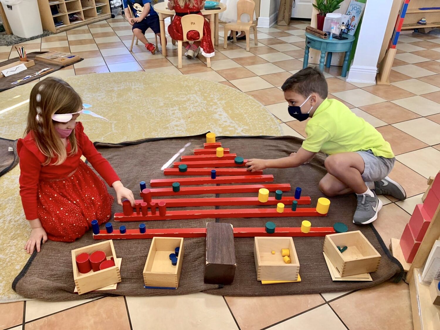 children building a toy christmas tree