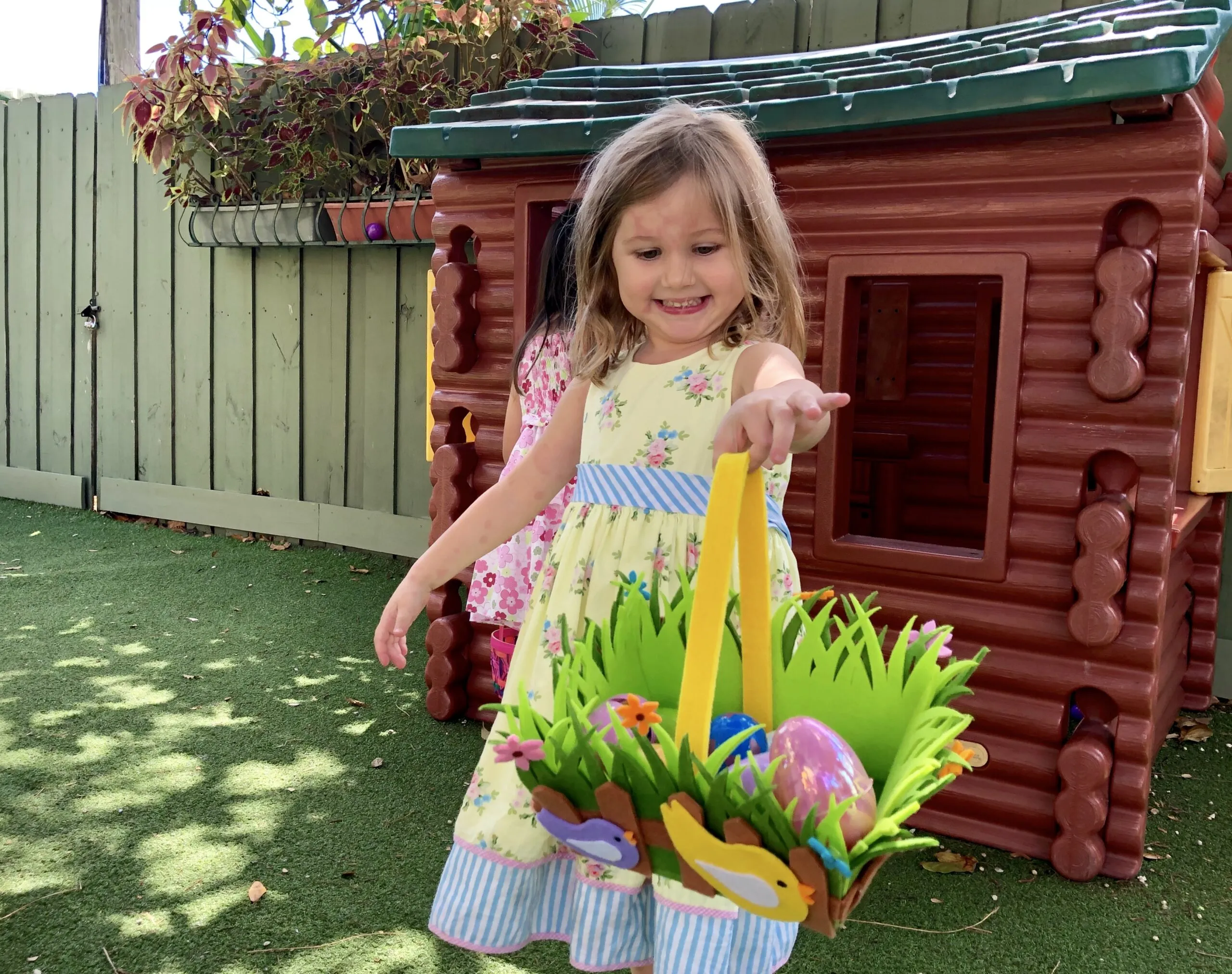 child with montessori easter basket